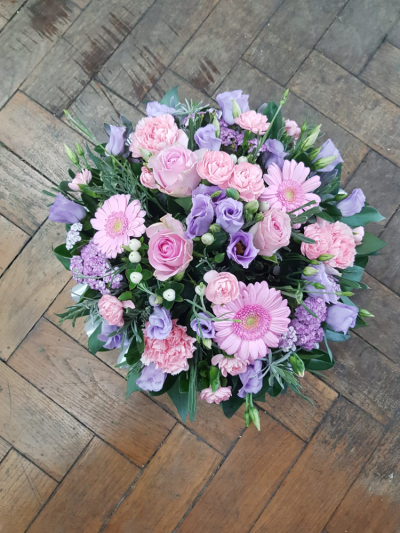 Peaceful Memories - A delicate posy of soft pink and lilac blooms, thoughtfully arranged to express love, sympathy, and gentle remembrance. A comforting tribute to honour a cherished life