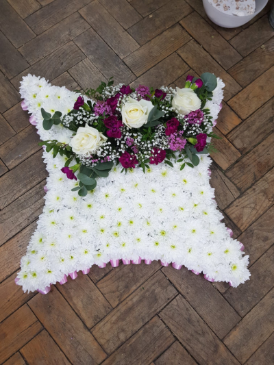 Eternal Grace Pillow - A soft and elegant funeral pillow featuring pink, lilac, and white blooms, thoughtfully arranged to express love, peace, and heartfelt remembrance. A gentle tribute to honour a cherished life and offer comfort to family and friends