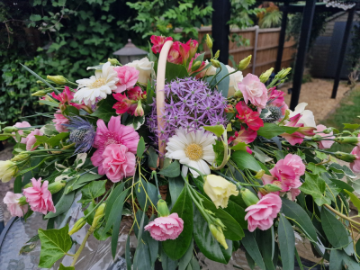 Heavenly Harmony Basket - A beautiful basket arrangement of purple, pink, and white blooms, thoughtfully designed to express love, peace, and heartfelt remembrance. A graceful tribute that offers comfort and honours a cherished life with gentle elegance