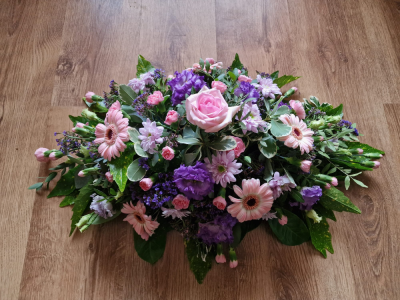 Lavender & Blush Spray - A graceful funeral spray of soft purple and pink blooms, thoughtfully arranged to express love, sympathy, and heartfelt remembrance. A beautiful tribute that brings comfort while honouring a cherished life with elegance and peace.