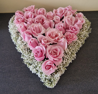 PinkRoseFuneralHeart - A beautiful pink rose funeral heart, symbolising love, grace, and heartfelt remembrance. Thoughtfully arranged, this elegant tribute expresses deep affection and serves as a lasting honour to a cherished life, offering comfort and sympathy to family and f
