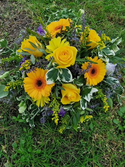 Eternal Light Posy - A delicate funeral posy of purple and yellow blooms, thoughtfully arranged to symbolise remembrance, warmth, and peace. This gentle tribute offers comfort while honouring a cherished life with grace and quiet beauty