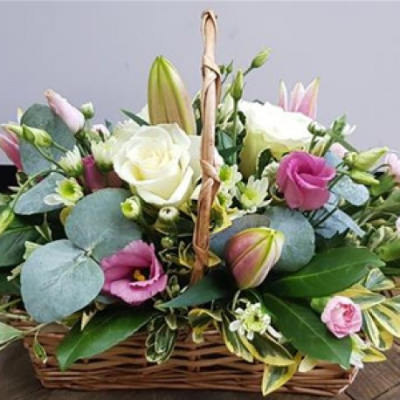 Cambridge Basket - A charming basket arrangement in soft pink and white tones, beautifully presented with fresh greenery for a thoughtful gift.