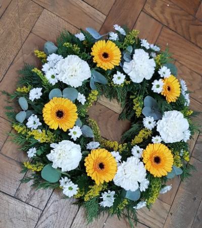 Fresh Wreath - A beautiful fresh wreath containing yellow gerbera, white carnations, chrysanthemums,  solidago and mix foliage. 12inch.