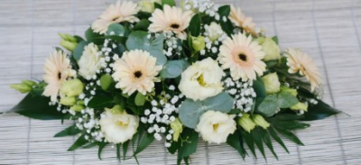 Peach and Cream Spray - Peach Gerbra, cream Lisianthus, Gypsophila and mixed foliage. Standard 3ft £85.00, deluxe 4ft £120.00 and luxury 5ft £185.00.