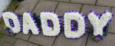 Daddy Letter Tribute - White Chrysanthemums with purple flowers and mixed foliage letter tribute.