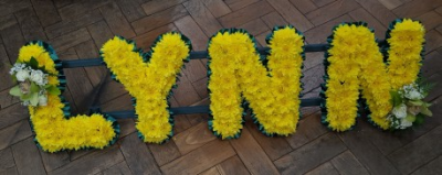 Lynn Letter Tribute - Yellow Chrysanthemums with white Roses and mixed foliage four letter tribute.