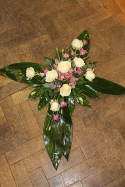 Green Cross - Cream Roses and pink spay Roses with mix Foliage on Aspidistra Leaf.