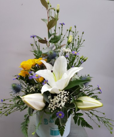 Baby Boy Vase - Baby boy vase arrangement in white, blues, and yellows in oasis.