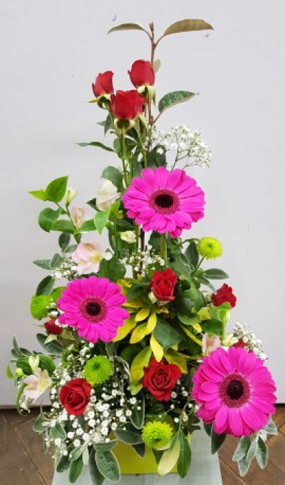 Love You always! - Pink and red front facing arrangement of flowers in oasis.