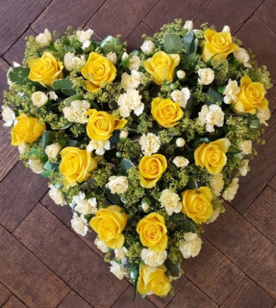 Yellow & White Heart - A beautiful heart-shaped funeral tribute arranged in bright yellow and soft white tones, creating a warm and heartfelt farewell. 17inch standard . 21 inch Deluxe